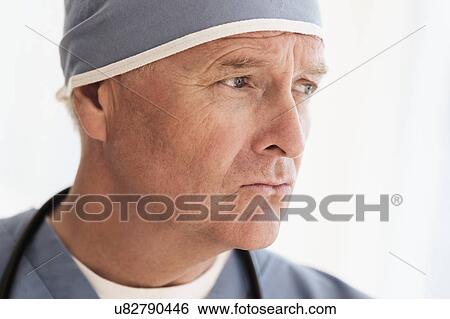 Portrait of surgeon in scrubs and surgical cap View Large Photo Image Stock Photograph - Portrait of surgeon in scrubs and surgical cap. Fotosearch