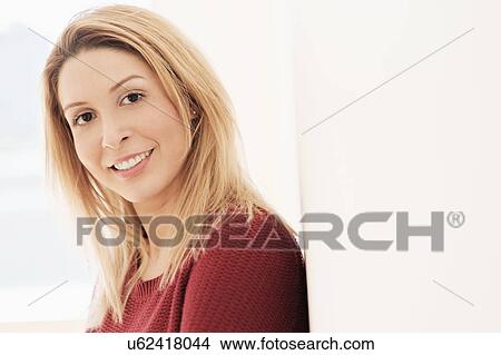 Picture - Portrait of young woman looking at camera. Fotosearch