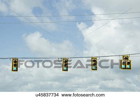 Road signals on cable against cloudy sky View Large Photo Image Picture - Road signals on cable against cloudy sky. Fotosearch