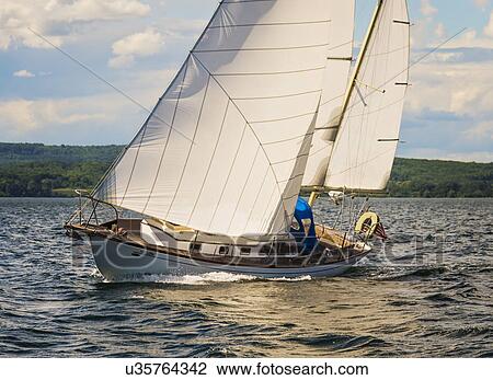 Stock Image - Sailboat in sea. Fotosearch