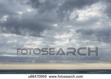 Scenic cloudscape with sunbeams View Large Photo Image Stock Photo - Scenic cloudscape with sunbeams. Fotosearch