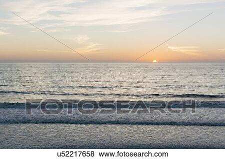 Scenic seascape at sunset View Large Photo Image Stock Photo - Scenic seascape at sunset. Fotosearch
