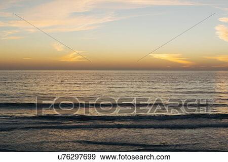 Stock Photo - Scenic seascape at sunset. Fotosearch