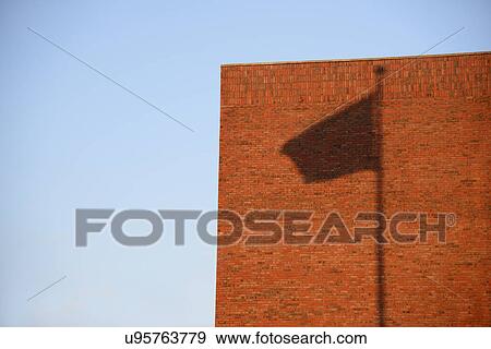 Stock Photo - Shadow of flag on wall. Fotosearch
