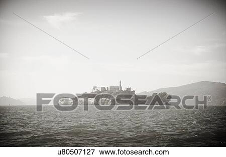 Silhouette of island on sea View Large Photo Image Stock Photo - Silhouette of island on sea. Fotosearch