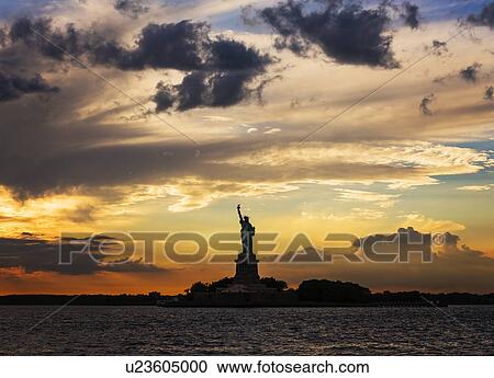 Silhouette of Statue of Liberty at sunset View Large Photo Image Stock Image - Silhouette of Statue of Liberty at sunset. Fotosearch
