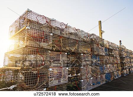 Stock Photo - Stacks of lobster traps against clear sky. Fotosearch