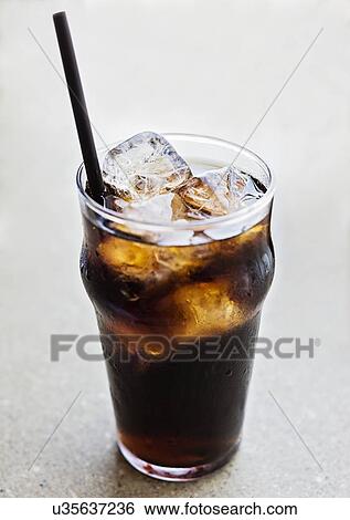 Stock Photograph - Studio shot of soda in glass. Fotosearch