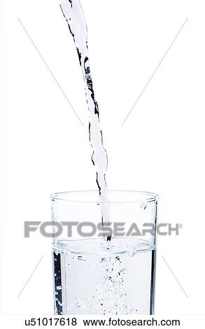 Stock Photo - Studio shot of water pouring into glass. Fotosearch