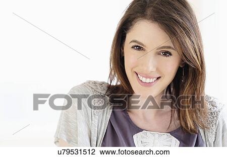 Studio shot portrait of smiling woman with brown hair View Large Photo Image Stock Image - Studio shot portrait of smiling woman with brown hair. Fotosearch