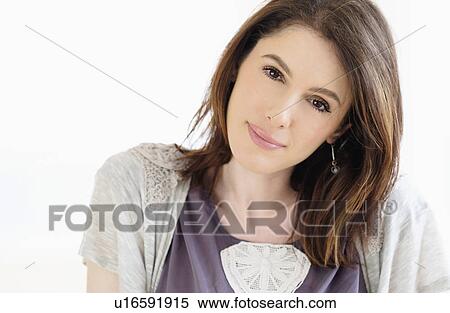 Stock Photography - Studio shot portrait of smiling woman with brown hair. Fotosearch
