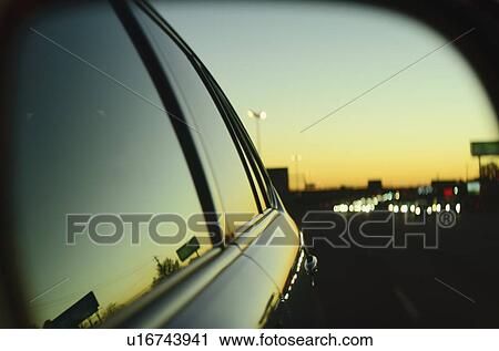Sunset in city reflected in car's window View Large Photo Image Stock Image - Sunset in city reflected in car's window. Fotosearch