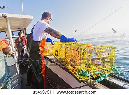 Three fishermen working on boat View Large Photo Image Stock Image - Three fishermen working on boat. Fotosearch