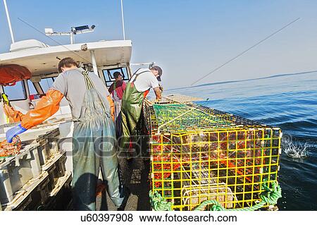 Three fishermen working on boat View Large Photo Image Stock Photo - Three fishermen working on boat. Fotosearch