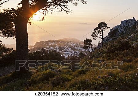 Stock Image - Town at sunset. Fotosearch