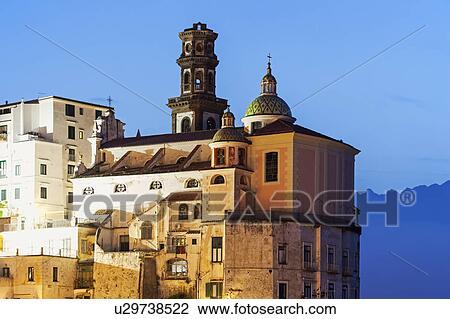 Townhouses and tower at dusk View Large Photo Image Stock Image - Townhouses and tower at dusk. Fotosearch