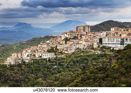 Stock Image - Townscape in mountainous landscape. Fotosearch