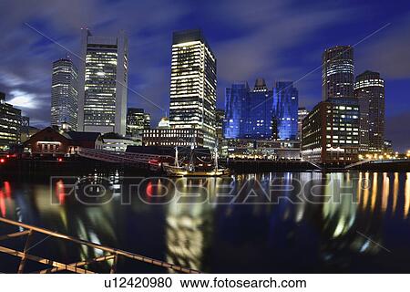 Stock Image - Waterfront reflected in Fort Point Channel at dawn. Fotosearch