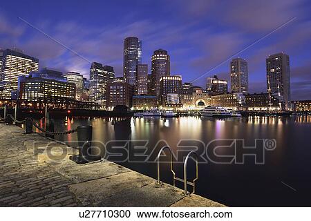Stock Image - Waterfront reflected in Fort Point Channel at dawn. Fotosearch