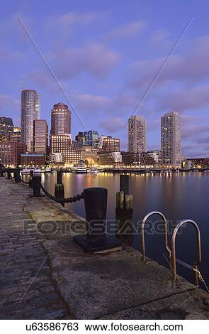 Stock Image - Waterfront reflected in Fort Point Channel at dawn. Fotosearch