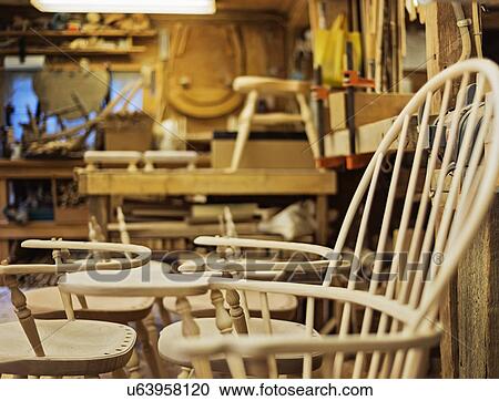Stock Image - Windsor chairs in preparation. Fotosearch