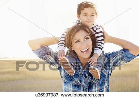 Woman playing with son (2-3) View Large Photo Image Stock Photo - Woman playing with son (2-3). Fotosearch