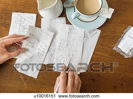 Stock Image - Woman writing on napkins. Fotosearch