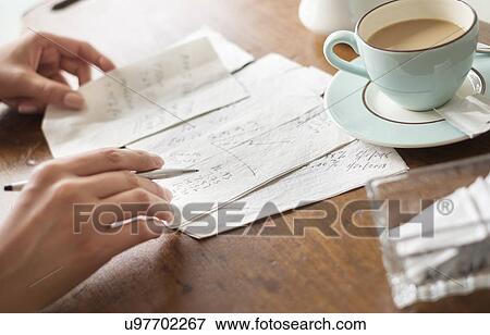 Woman writing on napkins View Large Photo Image Stock Photo - Woman writing on napkins. Fotosearch