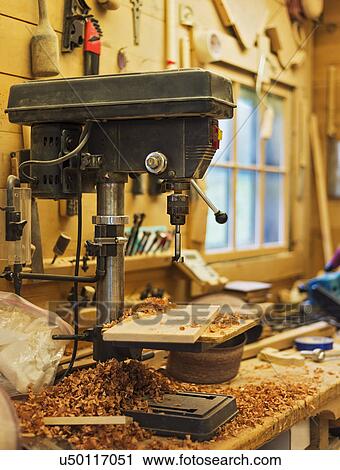 Stock Image - Woodworking drill in carpentry workshop. Fotosearch