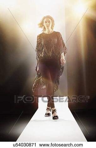 Stock Image - Young woman at fashion show. Fotosearch