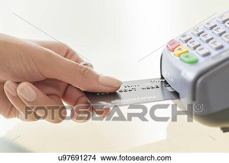Young woman paying with credit card View Large Photo Image Picture - Young woman paying with credit card. Fotosearch