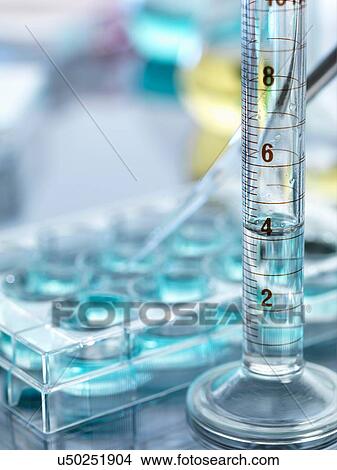 A close up of a volumetric cylinder containing a chemical formula in a laboratory View Large Photo Image Picture - A close up of a volumetric cylinder containing a chemical formula in a laboratory. Fotosearch