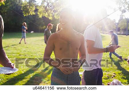 Adults friends at sunset party in park View Large Photo Image Stock Photograph - Adults friends at sunset party in park. Fotosearch