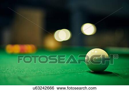 Close up of white cue ball on pool table View Large Photo Image Stock Photograph - Close up of white cue ball on pool table. Fotosearch