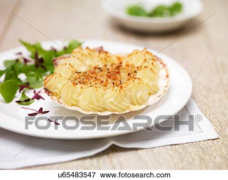 Coquille st jacques, scallops, potatoes and green salad leaves View Large Photo Image Stock Photo - Coquille st jacques, scallops, potatoes and green salad leaves. Fotosearch