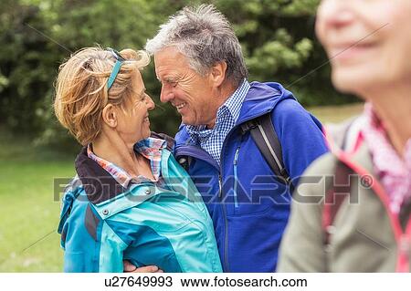 Couple hugging, face to face, smiling View Large Photo Image Stock Image - Couple hugging, face to face, smiling. Fotosearch