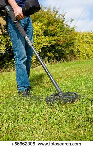 Cropped view of mature man searching grass using metal detector View Large Photo Image Stock Photography - Cropped view of mature man searching grass using metal detector. Fotosearch