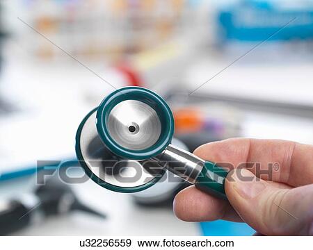 Stock Photo - Doctor holding stethoscope. Fotosearch