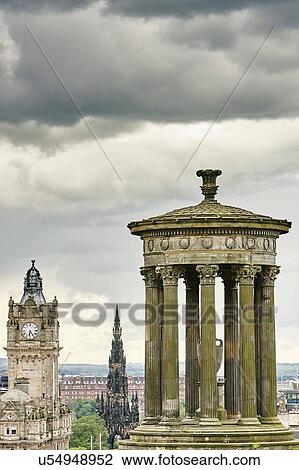 Stock Image - Elevated cityscape with Dugald Stewart monument and Scotts monument, Edinburgh, Scotland, UK. Fotosearch