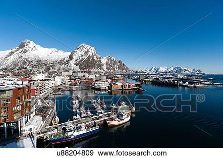 Elevated view of harbour and snow capped mountains, Svolvaer, Lofoten Islands, Norway View Large Photo Image Stock Photo - Elevated view of harbour and snow capped mountains, Svolvaer, Lofoten Islands, Norway. Fotosearch