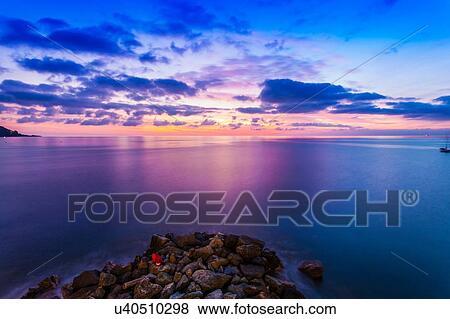 Elevated view of rocks and sea at sunset, Camogli, Liguria, Italy View Large Photo Image Stock Photo - Elevated view of rocks and sea at sunset, Camogli, Liguria, Italy. Fotosearch