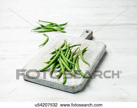 Extra fine green bean on wooden chopping board View Large Photo Image Stock Image - Extra fine green bean on wooden chopping board. Fotosearch