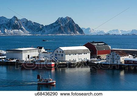 Fishing boat sailing by industrial buildings, Svolvaer, Lofoten Islands, Norway View Large Photo Image Stock Image - Fishing boat sailing by industrial buildings, Svolvaer, Lofoten Islands, Norway. Fotosearch
