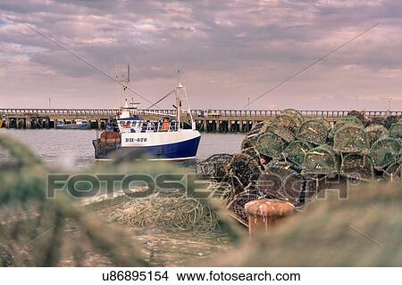 Picture - Fishing trawler in port at dawn. Fotosearch