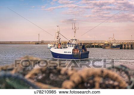 Fishing trawler in port at dawn View Large Photo Image Stock Photography - Fishing trawler in port at dawn. Fotosearch