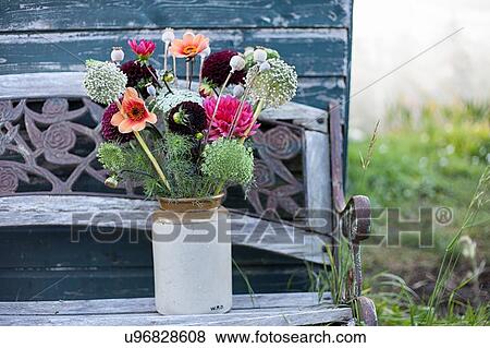 Stock Photo - Flower bouquet in jar at garden allotment. Fotosearch