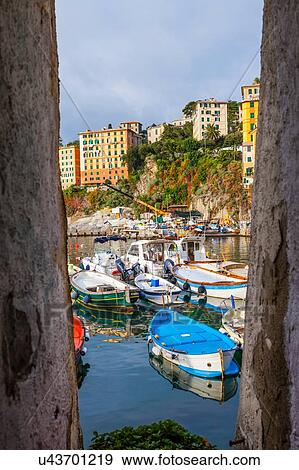 Framed view of fishing boats, Camogli, Liguria, Italy View Large Photo Image Stock Photo - Framed view of fishing boats, Camogli, Liguria, Italy. Fotosearch