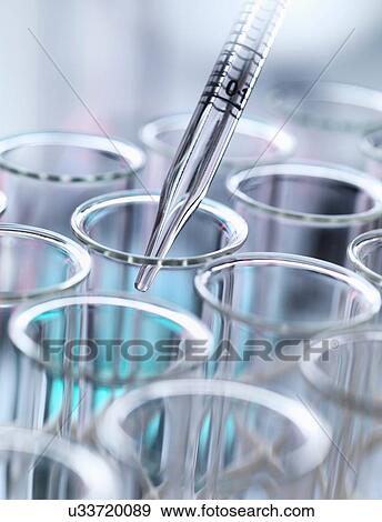 Stock Photo - Graduated pipette pipetting liquid into test tube. Fotosearch