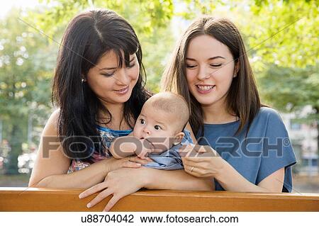 Grandmother, daughter and baby granddaughter on park bench View Large Photo Image Stock Image - Grandmother, daughter and baby granddaughter on park bench. Fotosearch