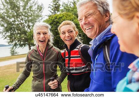 Group of friends hiking, smiling View Large Photo Image Picture - Group of friends hiking, smiling. Fotosearch